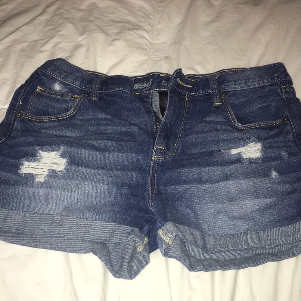 Dark wash shorts with a few rips